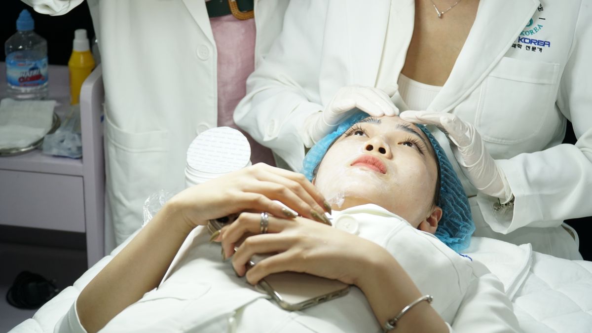 Client receiving a facial treatment at a skin care clinic; illustrative stock image.
